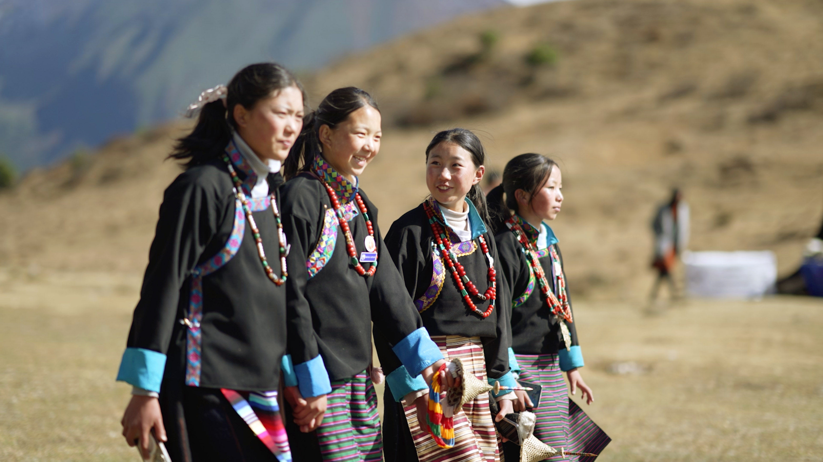 Girls of Laya walking together at the Royal Highland Festival, Bhutan