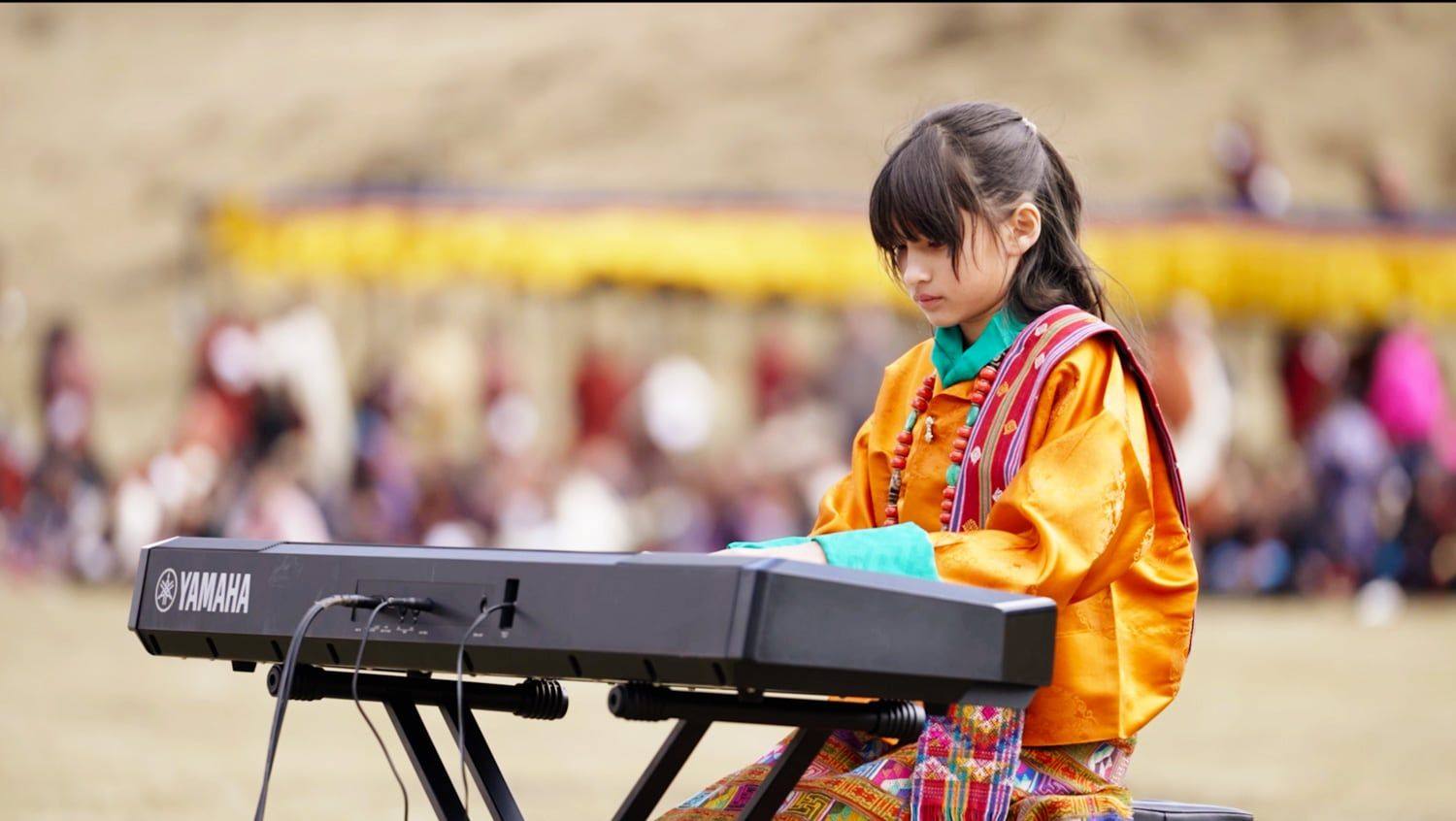 Hillary O’Sullivan, 12, performing at the Royal Highland Festival in Laya, Bhutan, at 4,000 metres, the performance at the centre of The Girl and Her Piano
